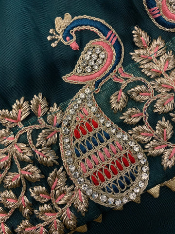 Bottle green Organza Saree with magenta peacock stitched blouse