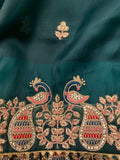 Bottle green Organza Saree with magenta peacock stitched blouse